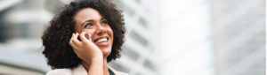 Smiling professional young adult on cellphone call